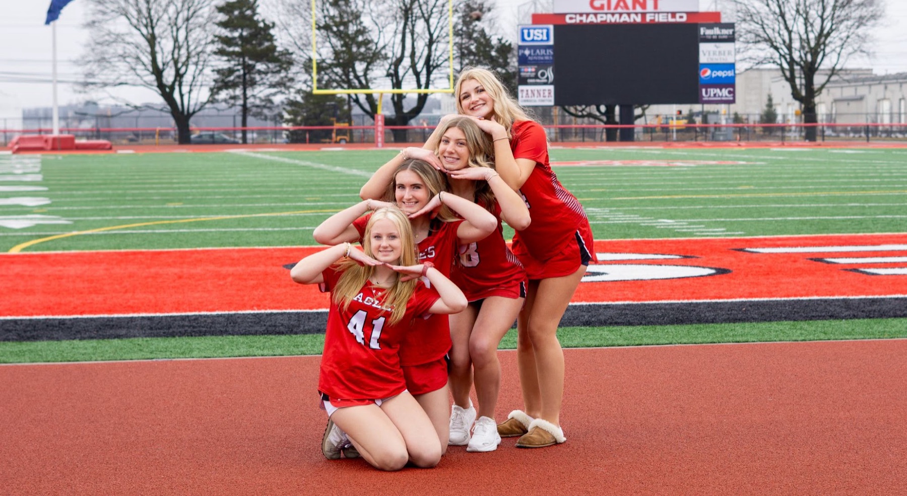 Cheerleaders celebrating on the track